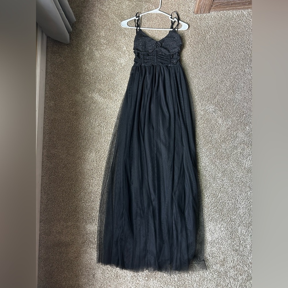 Long black prom dress, top resembles a corset top style